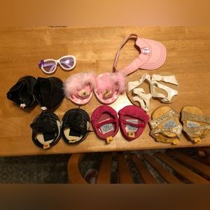 Lot of 7 pairs of  build a bear shoes, 1 pr sunglasses and a hat